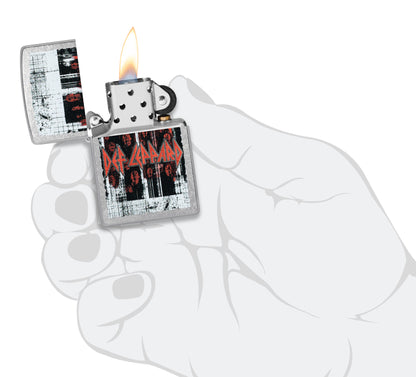 Zippo Def Leppard Logo Design Street Chrome Windproof Lighter lit in hand.