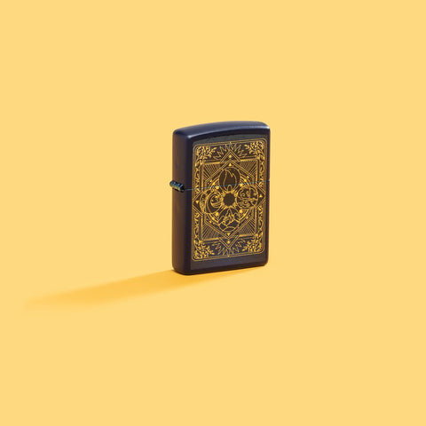 Lifestyle image of Zippo Elements Design Navy Matte Windproof Lighter on a yellow background.