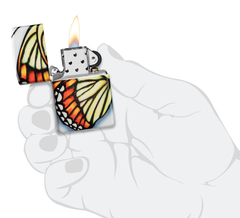 Zippo Butterfly Design 540 Color Windproof Lighter lit in hand.