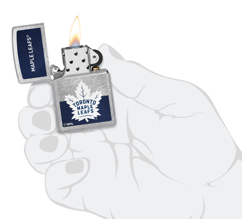 NHL® Toronto Maple Leafs Street Chrome™ Windproof Lighter lit in hand