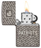 Zippo NFL New England Patriots Super Bowl Commemorative Armor Black Ice Windproof Lighter with its lid open and lit.