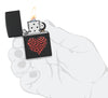 Zippo Heart Design Black Matte Windproof Lighter lit in hand.