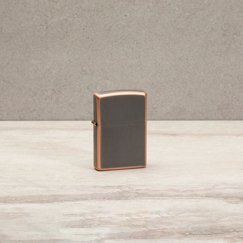 Lifestyle image of Classic Rustic Bronze Windproof Lighter standing on a countertop.