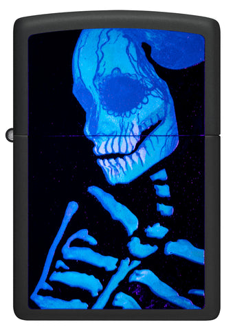 Front shot of Zippo Glowing Skull Design Black Matte Windproof Lighter glowing in a black light.