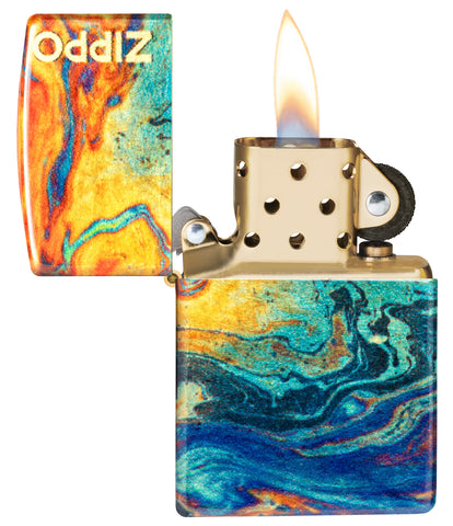 Zippo Colorful Design 540 Tumbled Brass Windproof Lighter with its lid open and lit.