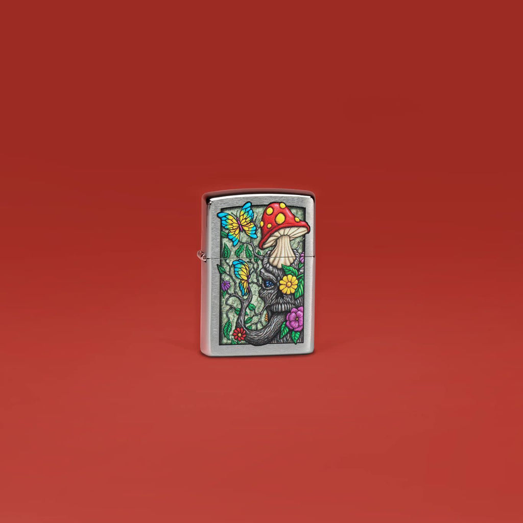 Lifestyle image of Zippo Freaky Nature Design Brushed Chrome Windproof Lighter standing in a red scene.