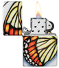 Zippo Butterfly Design 540 Color Windproof Lighter with its lid open and lit.