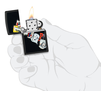 Zippo Cut and Paste Design Black Matte Windproof Lighter lit in hand.