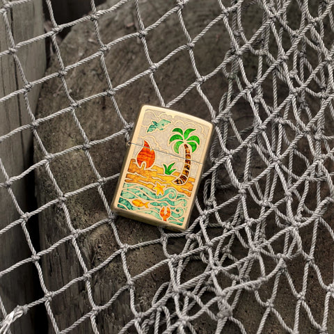 Lifestyle image of Zippo Beach Day Design High Polish Brass Windproof Lighter laying on a fishing net.