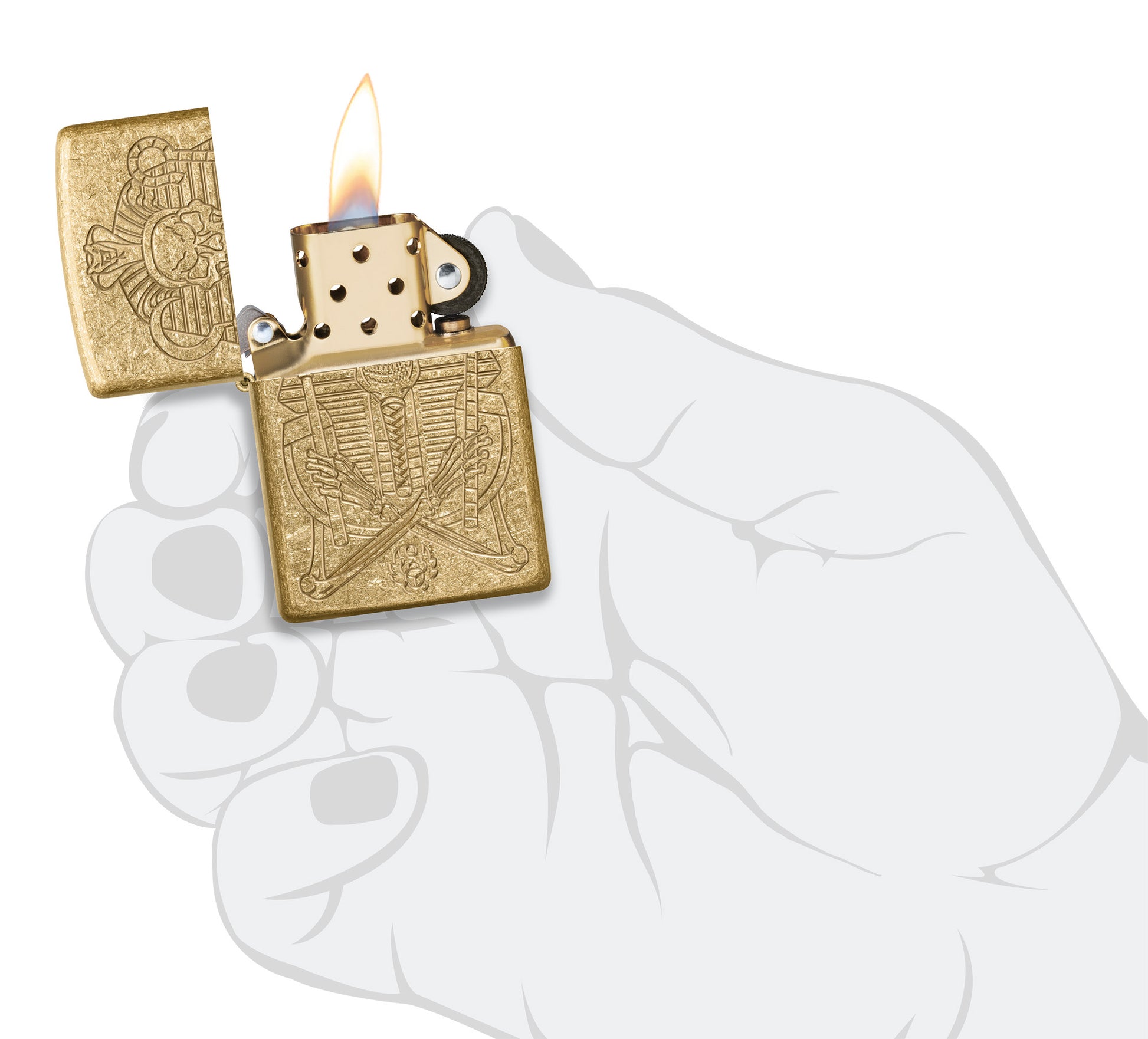 Zippo Mummy Design ArmorÂ® Tumbled Brass Windproof Lighter lit in hand.
