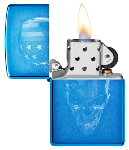 Zippo American Skull Design High Polish Blue Windproof Lighter with its lid open and lit.