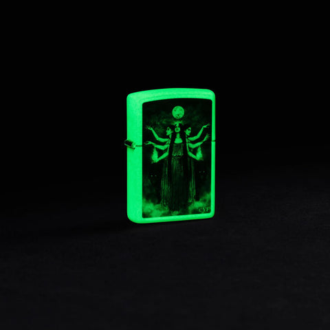 Lifestyle image of Zippo Victoria Frances Glow in the Dark Green Matte Windproof Lighter glowing in the dark.