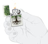 Zippo Tree Life Design White Matte Windproof Lighter lit in hand.