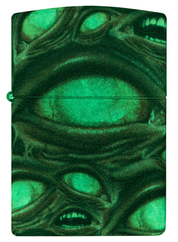 Front shot of Zippo Glow in the Dark Zombie Eye Windproof Lighter glowing in the dark.