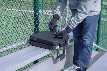 Lifestyle image of Zippo Heated Seat - Double with a man plugging in the HeatBank® 9 (not included)