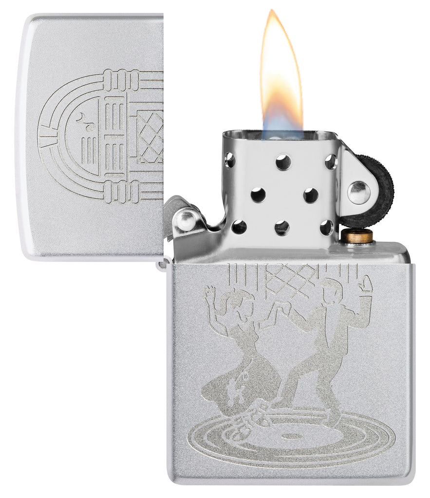 Zippo Vintage Dance Design Satin Chrome Windproof Lighter with its lid open and lit.
