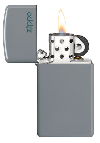 Slim® Flat Grey Zippo Logo Windproof Lighter with its lid open and lit.