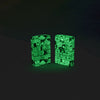 Lifestyle image of Zippo Abstract Design Glow in the Dark Green Windproof Lighter glowing in the dark.