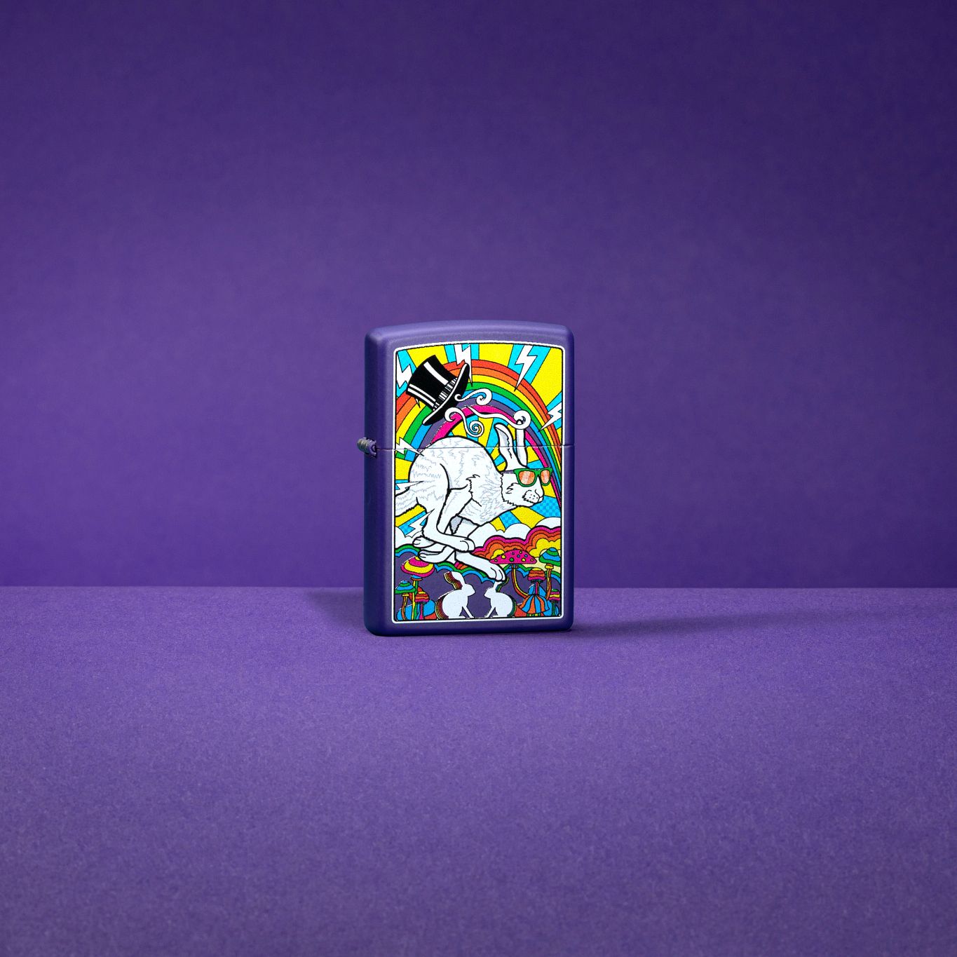 Lifestyle image of White Rabbit Design Purple Matte Windproof Lighter standing in a purple scene.