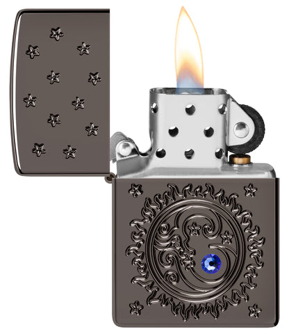 Zippo Ocean Crystal Black IceÂ® Windproof Lighter with its lid open and lit.