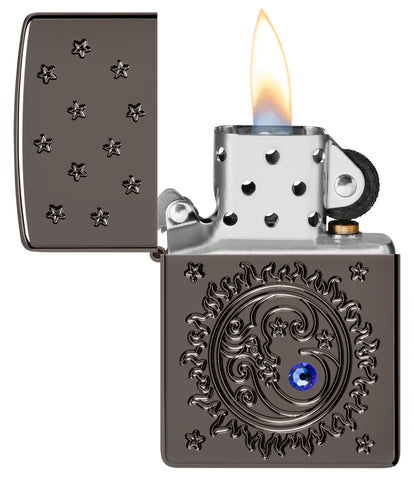 Zippo Ocean Crystal Black Ice® Windproof Lighter with its lid open and lit.