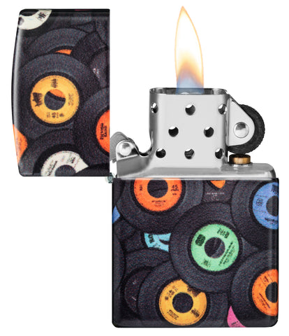 Zippo Records Design 540 Matte Windproof Lighter with its lid open and lit.