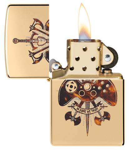 Zippo Gamer Creed Design High Polish Brass Windproof Lighter with its lid open and lit.