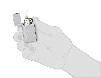 Zippo SlimÂ® Laser Pattern Design High Polish Chrome Windproof Lighter lit in hand.