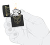Zippo Assassin's Creed Design Black Matte Windproof Lighter lit in hand.
