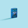 Lifestyle image of Zippo Anne Stokes Collection High Polish Blue Windproof Lighter on a pastel blue background.