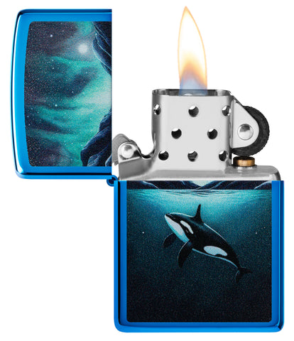 Zippo Whale Design High Polish Blue Windproof Lighter with its lid open and lit.