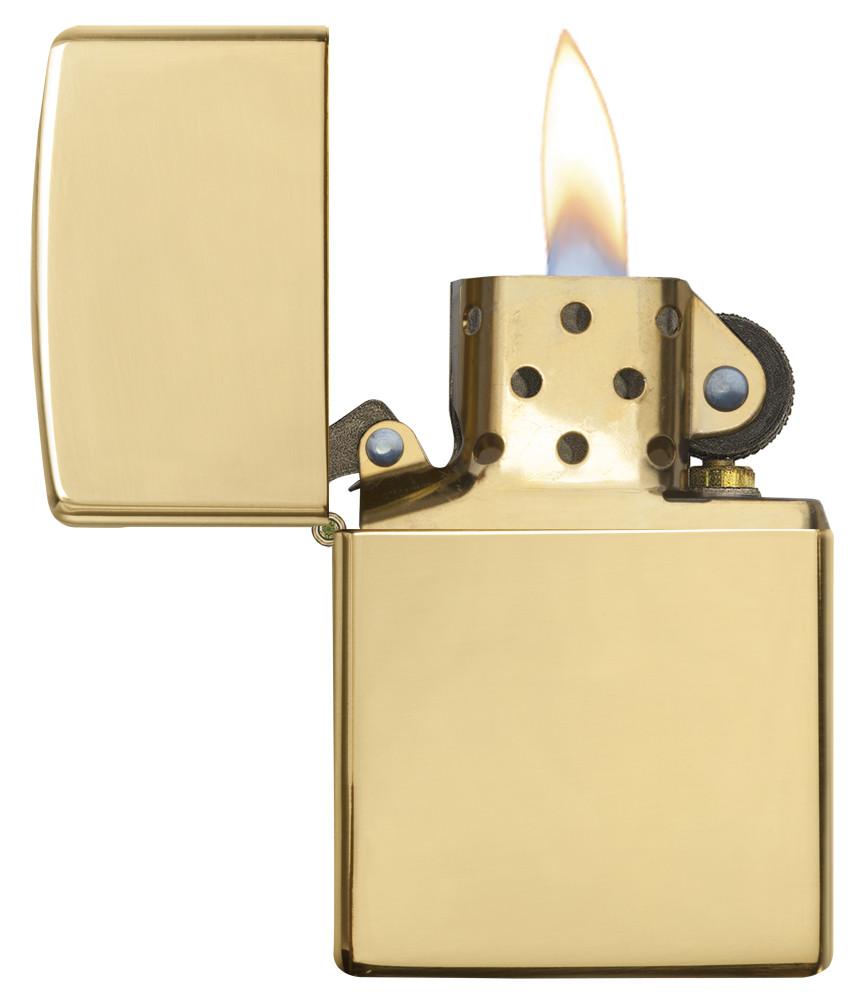 18 Kt. Gold Windproof Zippo Lighter with its lid open and lit