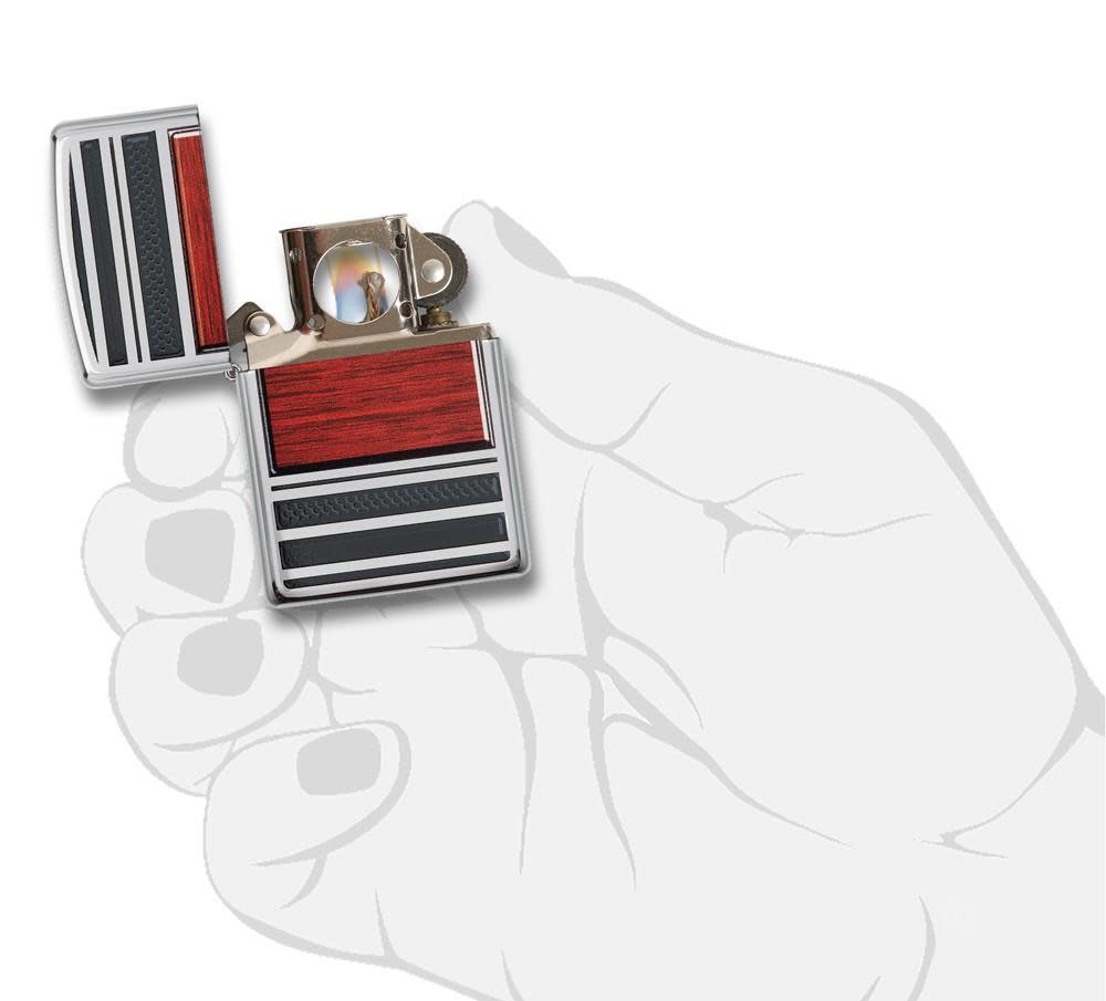Pipe Wood Design High Polish Chrome Windproof Lighter lit in hand.