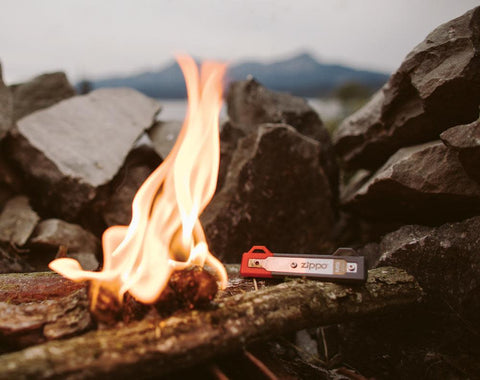 Campfire with mag strike laying on logs