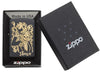 Front view of the Joke Skeleton Tipping Hat with Bronze Swirls on Black Matte Lighter in the one box packaging.