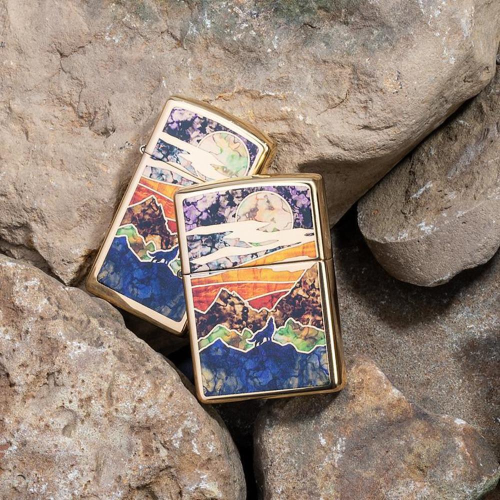 High Polish Brass Howling Wolf Windproof Lighter on rocks with slim version