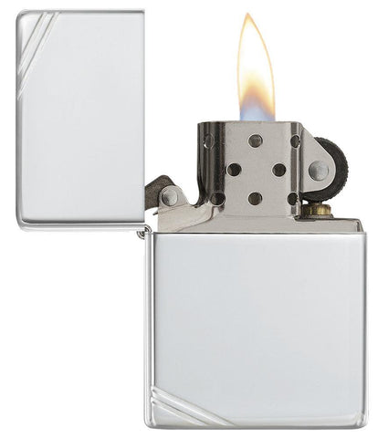 Sterling Silver Vintage with Slashes Windproof Lighter with its lid open and lit