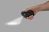 Black HeatBank® 9s Plus Rechargeable Hand Warmer in hand using the LED flashlight