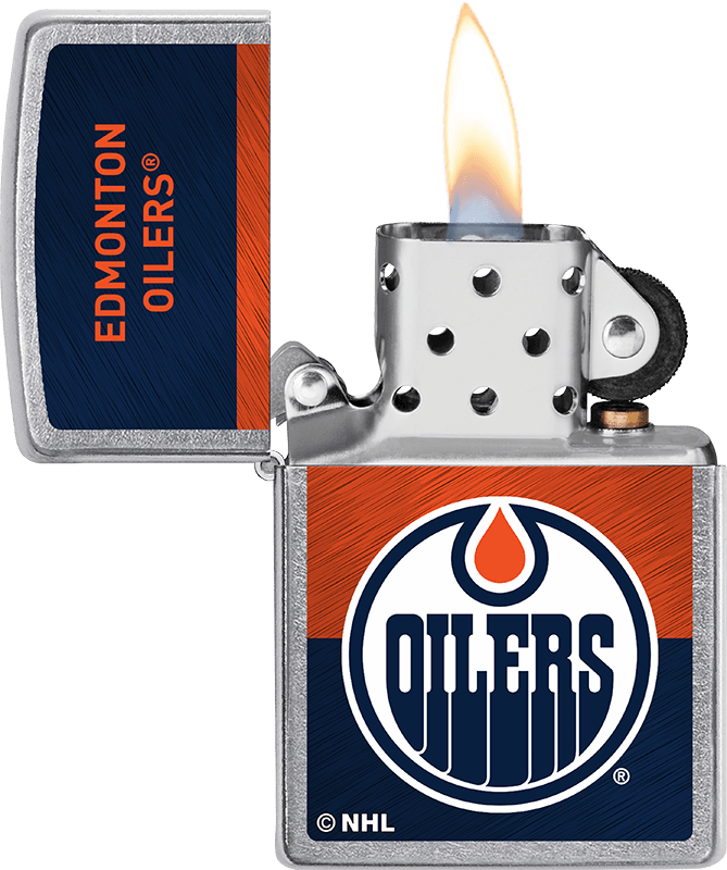 NHL® Edmonton Oilers Street Chrome™ Windproof Lighter with its lid open and lit