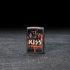 Lifestyle image of KISS Design End of the Road Tour Street Chrome™ Windproof Lighter standing in a dark scene.