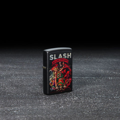 Lifestyle image of Slash Design Black Matte Windproof Lighter standing in a dark scene.