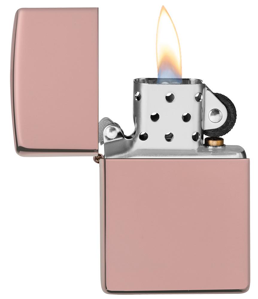 High Polish Rose Gold windproof lighter with the lid open and lit