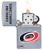 ©NHL Carolina Hurricanes Street Chrome™ Windproof Lighter with its lid open and lit