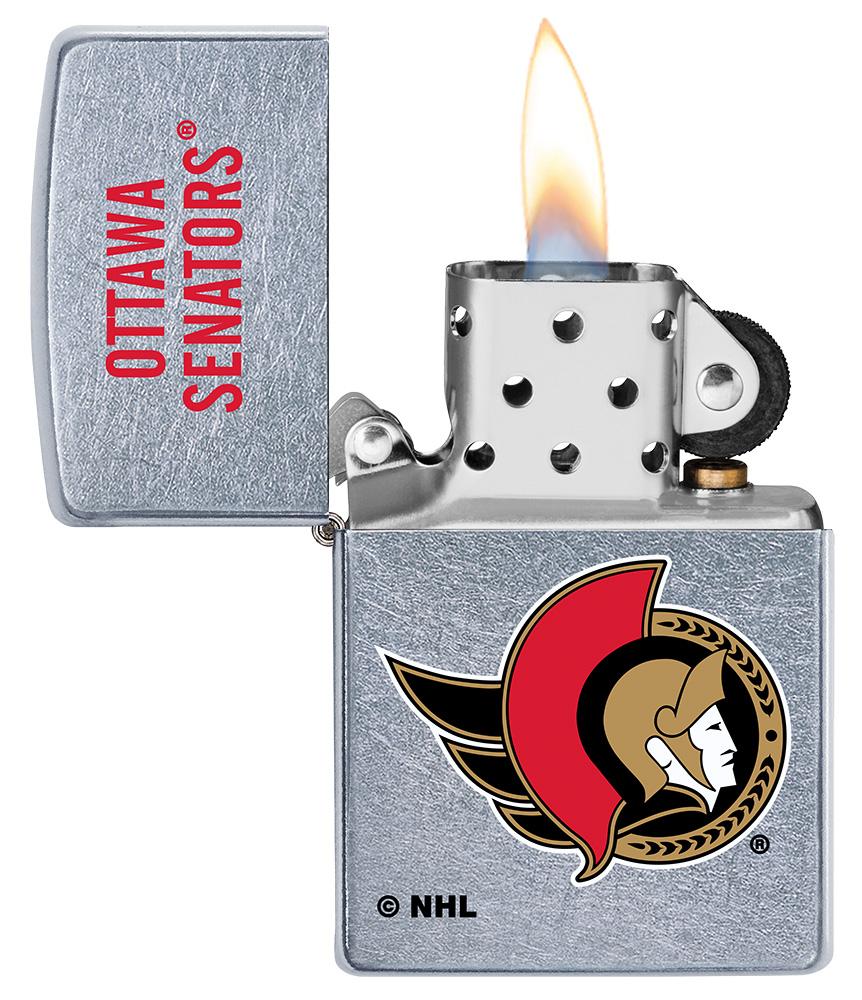 NHL Ottawa Senators Street Chrome™ Windproof Lighter lit in hand\