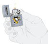 ©NHL Pittsburgh Penguins Street Chrome™ Windproof Lighter lit in hand