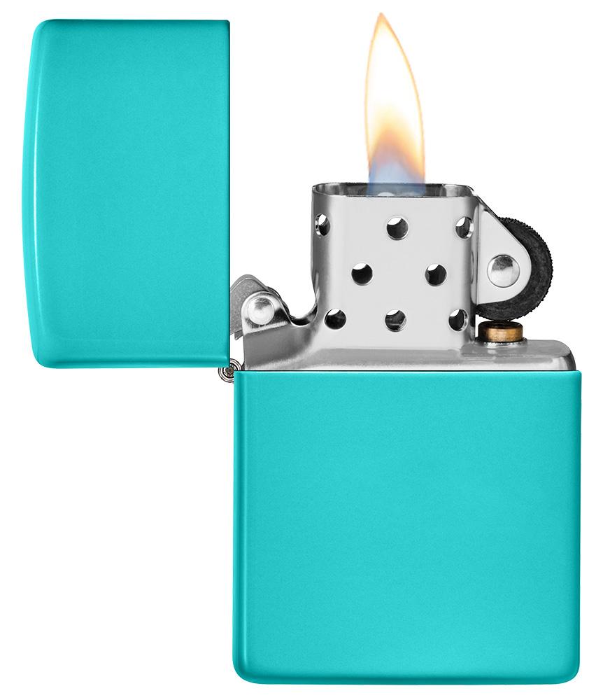 Classic Flat Turquoise Windproof Lighter with its lid open and lit
