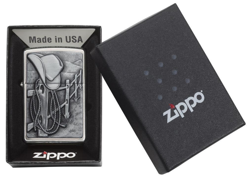 Resting Cowboy Windproof Lighter in its packaging.