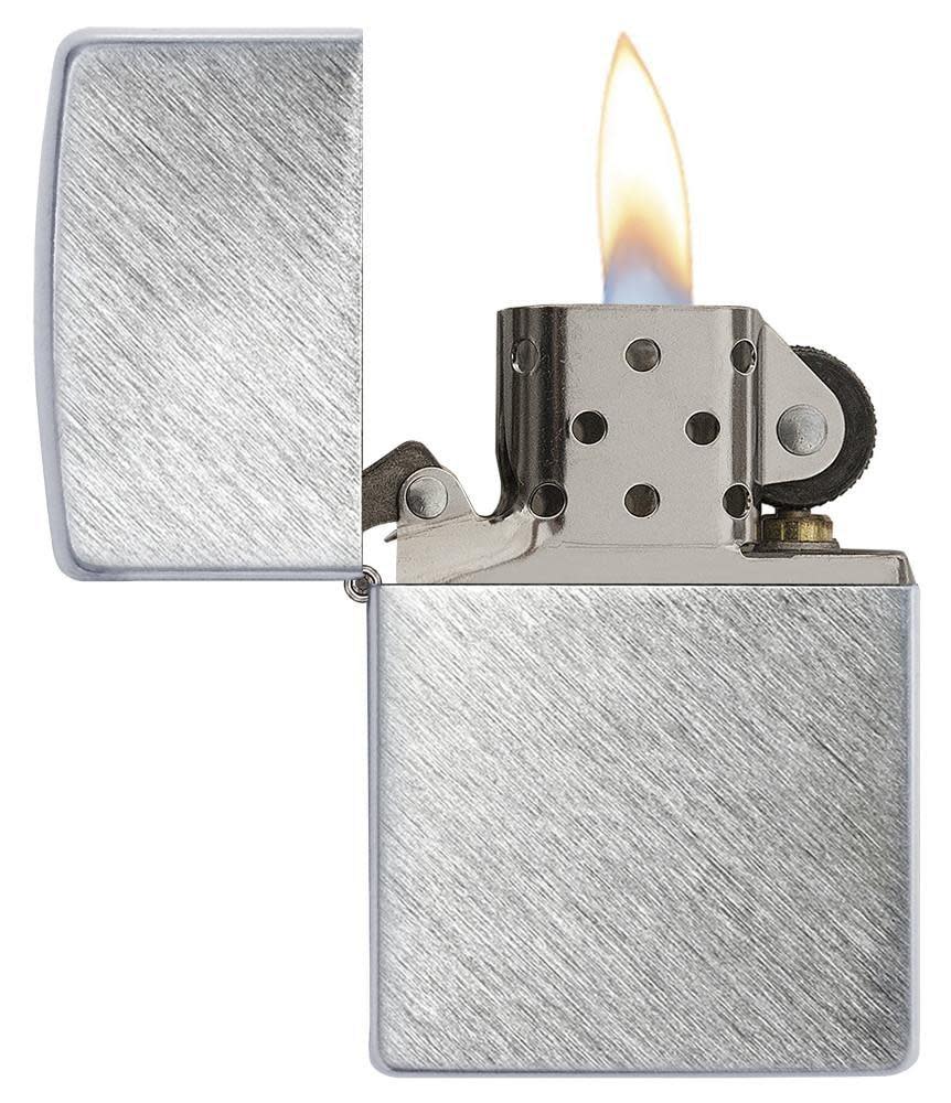 Herringbone Sweep Windproof Lighter with its lid open and lit.