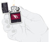 NFL Draft Arizona Cardinals Windproof Lighter lit in hand.