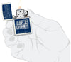 NFL Draft Dallas Cowboys Windproof Lighter lit in hand.